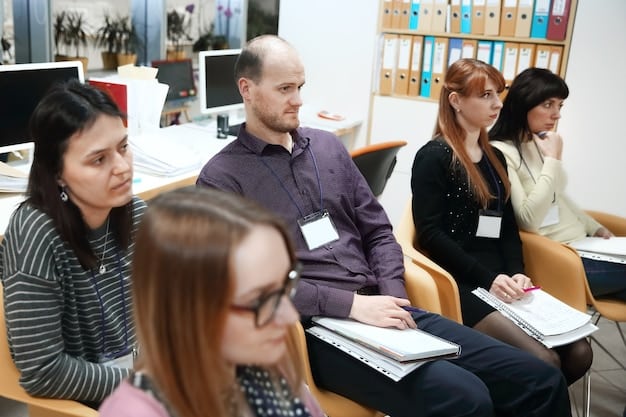 A group of teachers is participating in a professional development workshop. They are learning about new educational technologies and sharing best practices. The focus is on enhancing their skills and knowledge to implement the updated education standards.