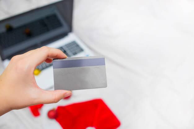 A close-up image of a hand holding a credit card, with a calculator and bills blurred in the background. The focus should be on the credit card and the numbers representing APR, highlighting the potential increase in interest rates.