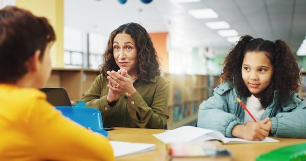 A teacher explaining a concept to a small group of high school students in a classroom. The students are engaged and asking questions.